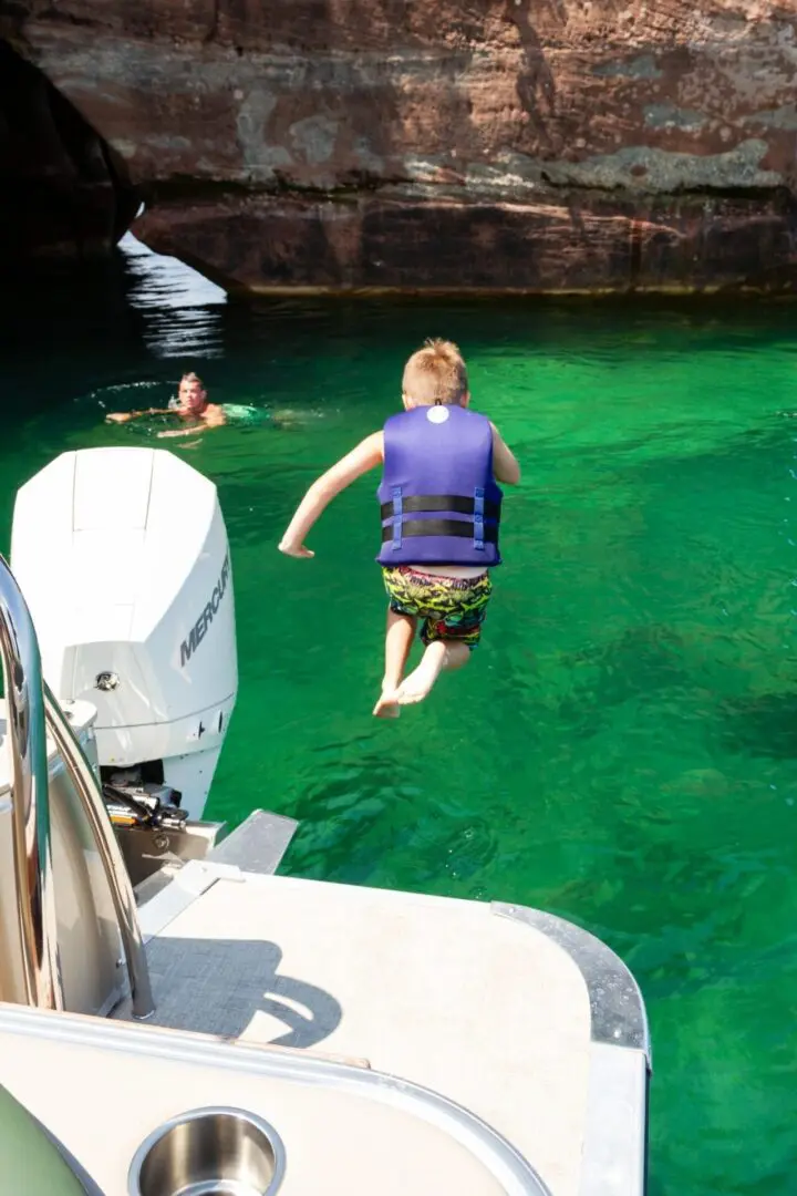 A person in the water with a life vest.