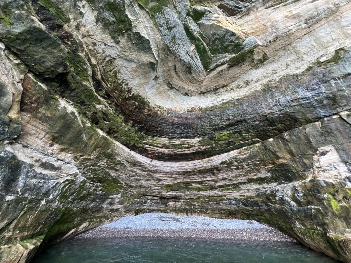 A rock formation with many rocks and water