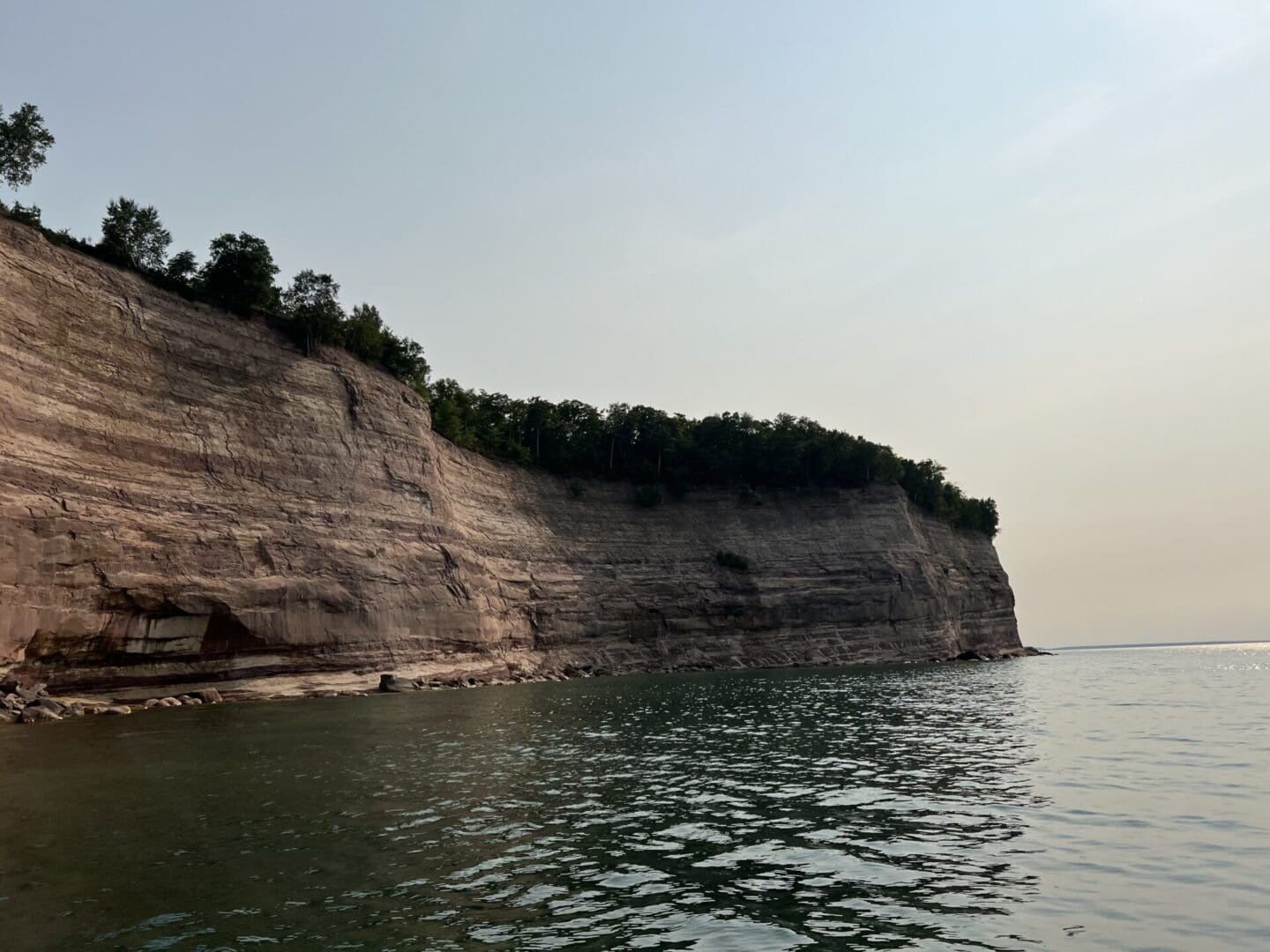 A body of water with trees on top of it.