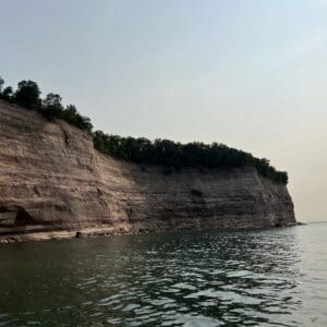 A body of water with trees on top of it.