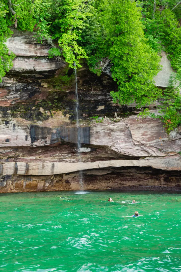 A waterfall is shown near the water.